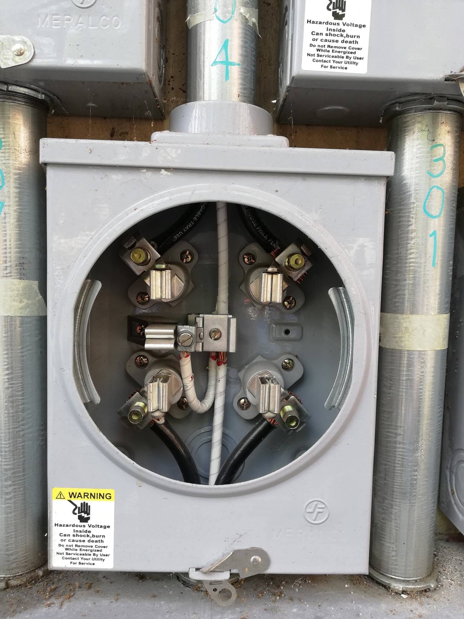 Residential Meralco electrical meter base with terminated conductors